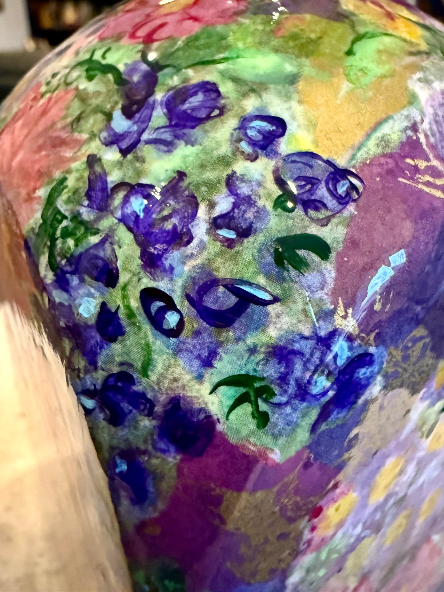 Maximalist style repurposed tequila bottle flower vase