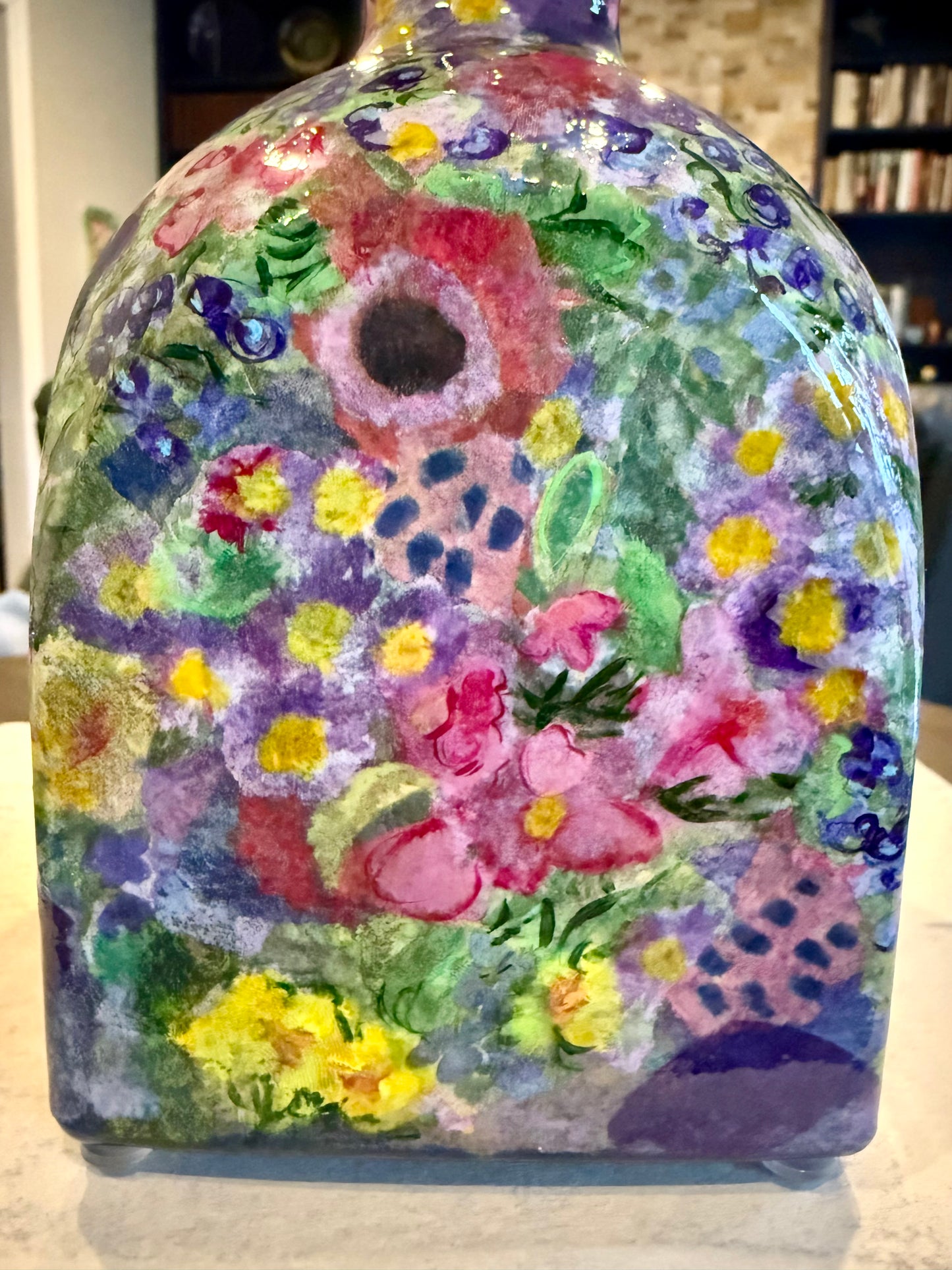 Maximalist style repurposed tequila bottle flower vase