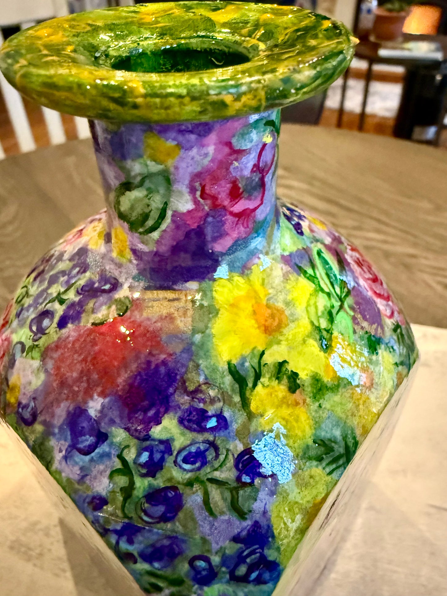 Maximalist style repurposed tequila bottle flower vase
